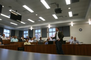 Joel Houston speaks to students in a classroom